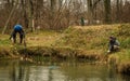 Two men catch fish netting in a pond in a village Royalty Free Stock Photo