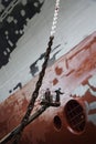 Two men in cherry picker working at ship in dry dock low angle view Royalty Free Stock Photo