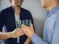 Two men clinking glasses and partying close up Royalty Free Stock Photo