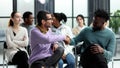 two men communicate while sitting on a chair waiting for a speaker Royalty Free Stock Photo