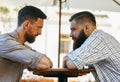 Men communicate with their views at the table Royalty Free Stock Photo