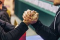 Two men competing in arm wrestling Royalty Free Stock Photo