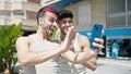 Two men couple smiling confident having video call at park Royalty Free Stock Photo