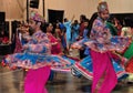 Two Men are dancing in action. Enjoying Hindu festival of Navratri Garba wearing traditional consume.