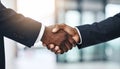 Two men of different ethnicities shaking hands in a business context handshake agreement Royalty Free Stock Photo