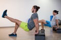 Two men doing aerobic exercise on stepper Royalty Free Stock Photo