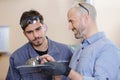 two men doing induction hardening in workshop Royalty Free Stock Photo