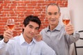 Two men drinking rose Royalty Free Stock Photo