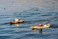 Two men in dugout canoes on Lake Atitlan, Guatemala Royalty Free Stock Photo