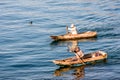 Two men in dugout canoes on Lake Atitlan, Guatemala Royalty Free Stock Photo