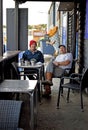 Two men enjoying a beverage break.