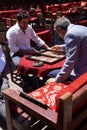 Two men enjoying a game of backgammon Royalty Free Stock Photo