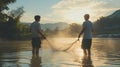 Two Men Fishing with a Net in a River at Sunset Royalty Free Stock Photo