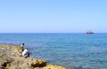 Paphos harbour men fishing in Cyprus