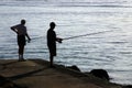 Two men fishing in the sea. Royalty Free Stock Photo