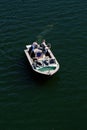 Two Men Fishing On Small Boat On River From Above Royalty Free Stock Photo