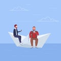 Two men floating on paper boat guys using gadgets traveling together digital addiction web surfing concept full length Royalty Free Stock Photo