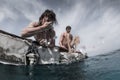 Two men floating in the tropical sea Royalty Free Stock Photo