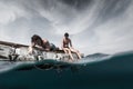 Two men floating in the tropical sea Royalty Free Stock Photo