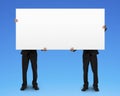 Two men holding blank board Royalty Free Stock Photo