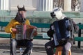 Two men with horse masks playing music Royalty Free Stock Photo