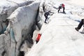 Two men are ice climbing in a crevasse of glacier Pasterze at icefall Hufeisenbruch in Glockner Group, Austria Royalty Free Stock Photo