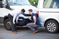 Two Men Inspecting The Car Damaged After Accident Royalty Free Stock Photo
