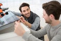 two men installing kitchen hob Royalty Free Stock Photo