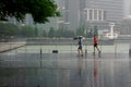Men jogging under the rain in Singapore