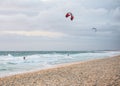 Two men kitesurfing on the beach in Indian ocean in Perth