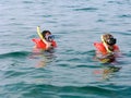 Two men in the life vests and masks Royalty Free Stock Photo