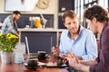 Two men meeting at a coffee shop