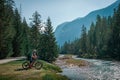 Mountainbiking along river Isar in the Karwendel mountains during blue sky day in summer, Austria Royalty Free Stock Photo