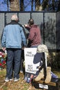 Two men at the Moving Wall for Vietnam War pointing Royalty Free Stock Photo