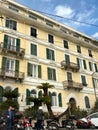 Two men near moped motorcycles parking and beautiful italian apartment building Royalty Free Stock Photo