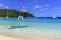 Friends enjoy a dreamy swim in clear turquoise waters off the paradise island of Mayreau in the Grenadines