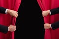 Two Men Opening Red Curtain Royalty Free Stock Photo