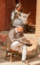Two Men Outdoors Reading Newspapers Kathmandu Nepal