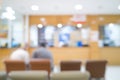 Two men patients waiting at Pharmacy. Blured background of healthcare.