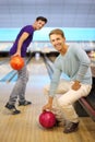 Two men play in bowling club; Royalty Free Stock Photo