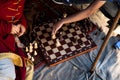 Two men play chess outdoors. Close up. Only hands can be seen Royalty Free Stock Photo