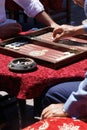 Two men playing a game of backgammon (tavla) in a teahouse in Istanbul, Turkey Royalty Free Stock Photo