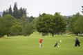 Two Men Playing Golf - Horizontal Royalty Free Stock Photo