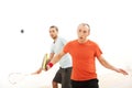 Two men playing match of squash. Royalty Free Stock Photo