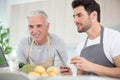 two men preparing vegetables in home Royalty Free Stock Photo