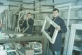 Two men professional labours with finished PVC profiles and wind Royalty Free Stock Photo