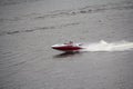 Two men are rapidly moving in a motor boat Royalty Free Stock Photo