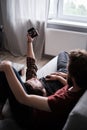 Two men relaxing together on the sofa Royalty Free Stock Photo