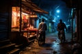 two men riding bicycles down a street at night Royalty Free Stock Photo