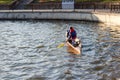 Two men are riding a kayak